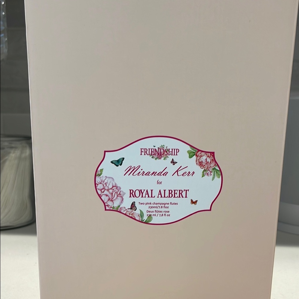 Two pink champagne flutes. Miranda Kerr for Royal Albert. With butterfly etching